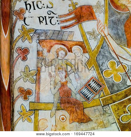 Playing medieval board game, Romanesque fresco in St. Bendt church Ringsted, Denmark - February 20, 2015
