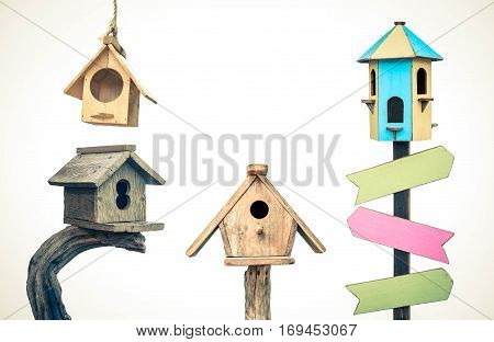 Different types of wooden bird houses isolated on white background