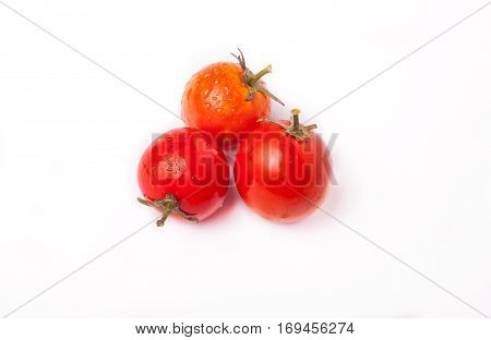 red fresh tomatoes on a white background