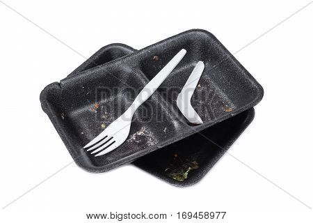 Garbage from take away food. Black foam food box and plastic spoon and fork