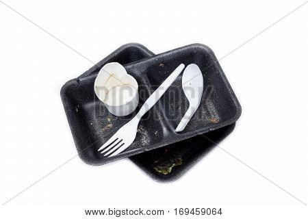 Garbage from take away food. Black foam food box and plastic spoon and fork