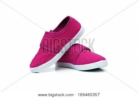 Magenta slip on shoes isolated on white