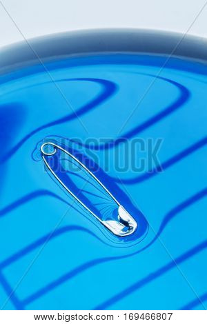 Physical experiment - pin floating on water surface.