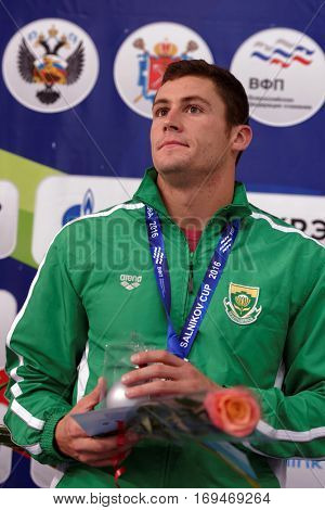 ST. PETERSBURG, RUSSIA - DECEMBER 17, 2016: Silver medalist in 50 m freestyle swimming Douglas Erasmus of RSA in medal ceremony of X Vladimir Salnikov Cup. Athletes from 6 countries participated