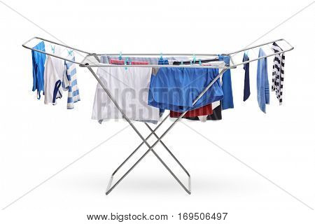 Rack dryer with clothes hanging isolated on white background