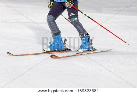 STOCKHOLM SWEDEN - JAN 31 2017: Closeup of the skiis and legs of officials inspecting the ski used for parallel slalom at the Alpine Audi FIS Ski World Cup. January 31 2017 Stockholm Sweden