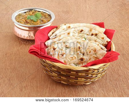 Indian food kulcha, a type of traditional and popular bread, and vegetable curry.