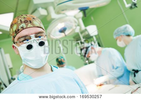 male cardiac surgeon at child cardiosurgery operating room