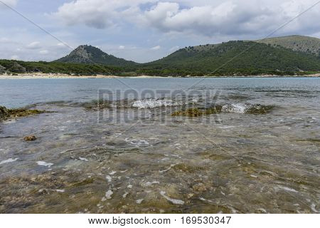 Rocks by the Mediterranean sea on the island of Ibiza in Spain, holiday and summer scene