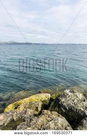 Rocks by the Mediterranean sea on the island of Ibiza in Spain, holiday and summer scene