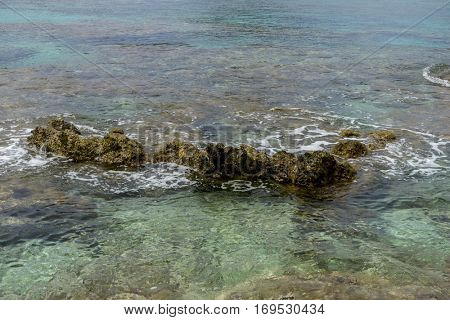Cliff, Rocks by the Mediterranean sea on the island of Ibiza in Spain, holiday and summer scene