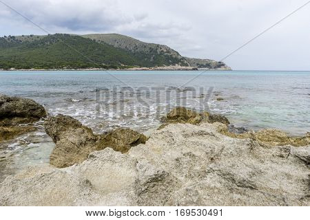 Rocks by the Mediterranean sea on the island of Ibiza in Spain, holiday and summer scene