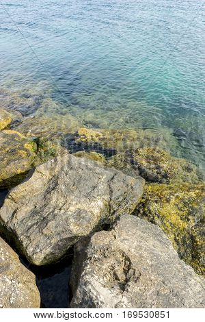 Rocks by the Mediterranean sea on the island of Ibiza in Spain, holiday and summer scene