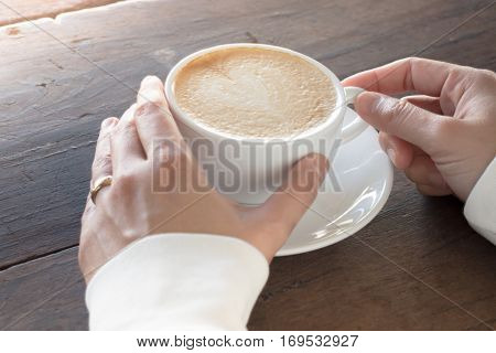 Hot cup of coffee latte stock photo