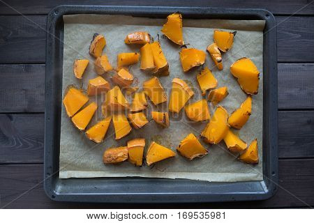 roasted pumpkin slices on a baking sheet