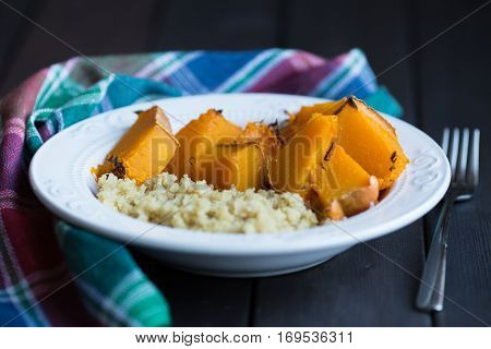 a dish of cooked pumpkin and quinoa.