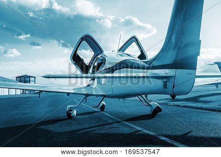 Private single turboprop aircraft parked on runway in sunny day. Travel concept. Sport concept. Ready for fly.