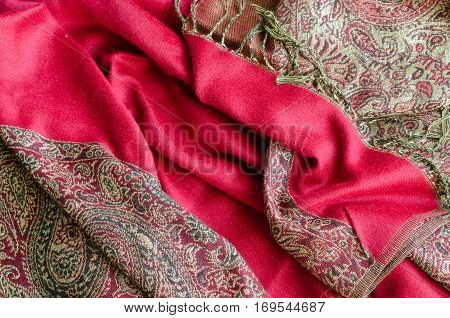 Texture of cashmere pashmina textile red and golden colors