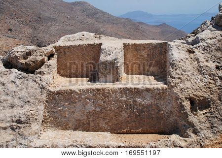 The Thrones of Zeuss and Hekate carved into the rock in the hills above Chorio on the Greek island of Halki. The inscribed stones date from the Hellenistic period of Ancient Greece (323-31BC)
