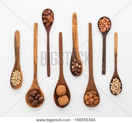 Different Kind Of Beans And Lentils In Wooden Spoon On White Wood Background. Mung Bean, Groundnut,