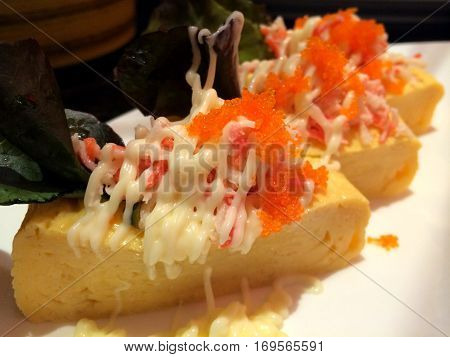 Sweet egg sashimi stuff with shrimp Caviar and rocket top with mayonnaise