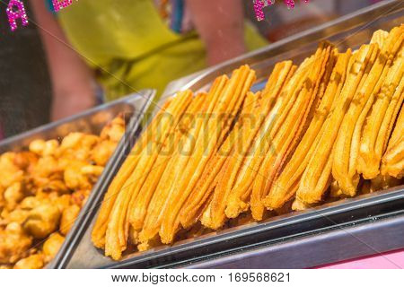 closeup on fresh spanish churros in a shop