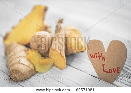 Ginger On Wooden Background