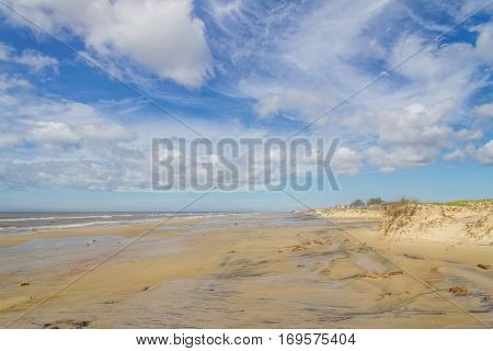 abandoned fisherman village at the tavares beach with cloudy and blue sky