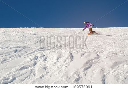 Stylysh beginner snowboarder man in caucasian mountains