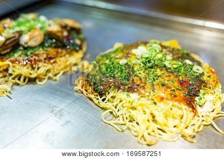 Japanese savoury pancake containing a variety ingredients