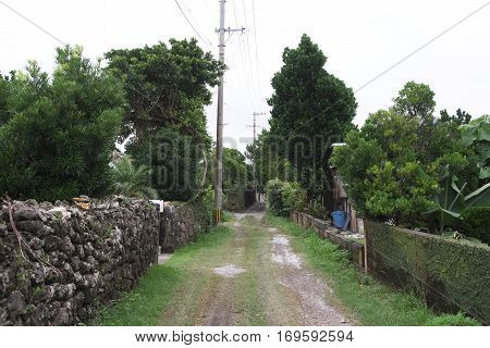 Road of residential area not paved on remote island of Okinawa