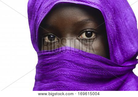 Gorgeous African Girl Hidden by a Violet Head Scarf Outdoors (Isolated on White)