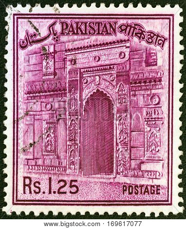 PAKISTAN - CIRCA 1961: A stamp printed in Pakistan shows the gateway of Chota Sona Masjid, Bangladesh, circa 1961.