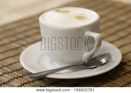 Cup of a coffee on a table