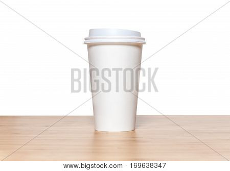 Cup Of Coffee On Wood Table In White Background.