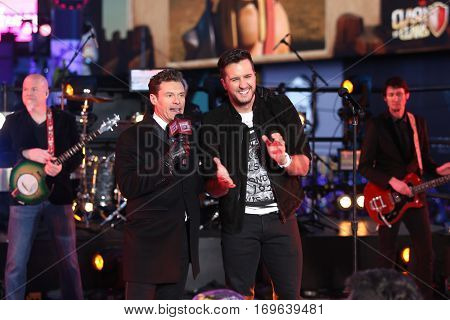 NEW YORK-DEC 31: Recording artist Luke Bryan (R) and host Ryan Seacrest onstage during Dick Clark's New Year's Rockin' Eve at Times Square on December 31, 2015 in New York City.