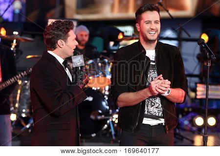 NEW YORK-DEC 31: Recording artist Luke Bryan (R) and Ryan Seacrest onstage during Dick Clark's New Year's Rockin' Eve at Times Square on December 31, 2015 in New York City.