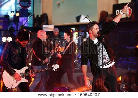 NEW YORK-DEC 31: Recording artist Luke Bryan (R) performs during Dick Clark's New Year's Rockin' Eve at Times Square on December 31, 2015 in New York City.