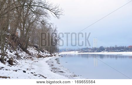Coast of Neva River and Cable stayed bridge on the outskirts of St. Petersburg at winter Russia.
