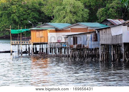 Old house of the Thai fisherman in the sea near the mangrove forest.