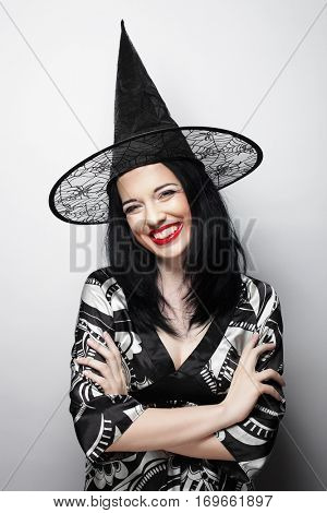 Funny Witch. Young happy woman with canival hat.