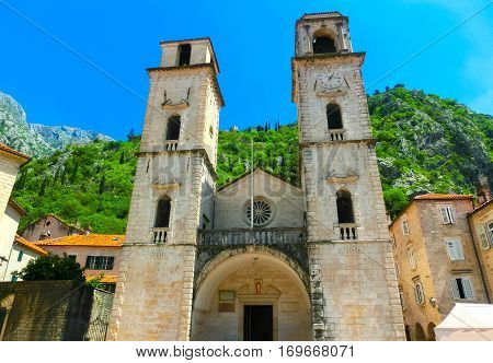 Cathedral Saint Tryphon is Roman Catholic cathedral in old town of Kotor, Montenegro. Lovcen mountain at background.