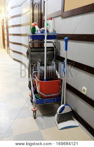 Interior of a corridor in an office center, hospital or something like this with the equipment for a professional cleaning