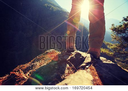 young woman hiker enjoy the view on sunrise himalaya mountains