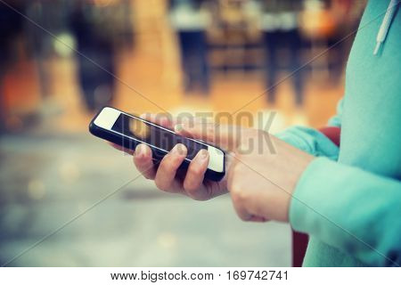 hands use smartphone taking photo front of shopwindow