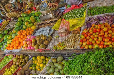 Market food street in Asia. Vegetables on market in Sri Lanka. Tropical fruit farmers. Outdoor market in Sri-Lanka. Buying oriental food.