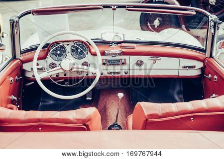 luxury car interior, leather steering wheel front seats and dashboard panel