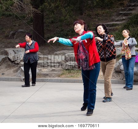 Beijing, China - March 8, 2015: Chinese Ladies Dancing In Beihai Park On International Women's Day