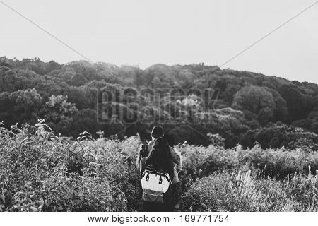 People walking in grassland on the mountain, Kew Mae Parn national park, Chiang Mai Thailand