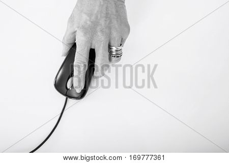 Senior businesswoman's hand using computer mouse
